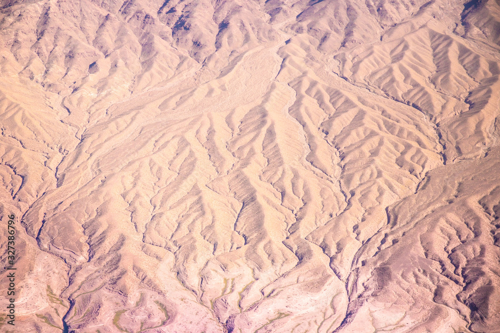 Aerial Photography over western United States with landforms, desert and mountains in view