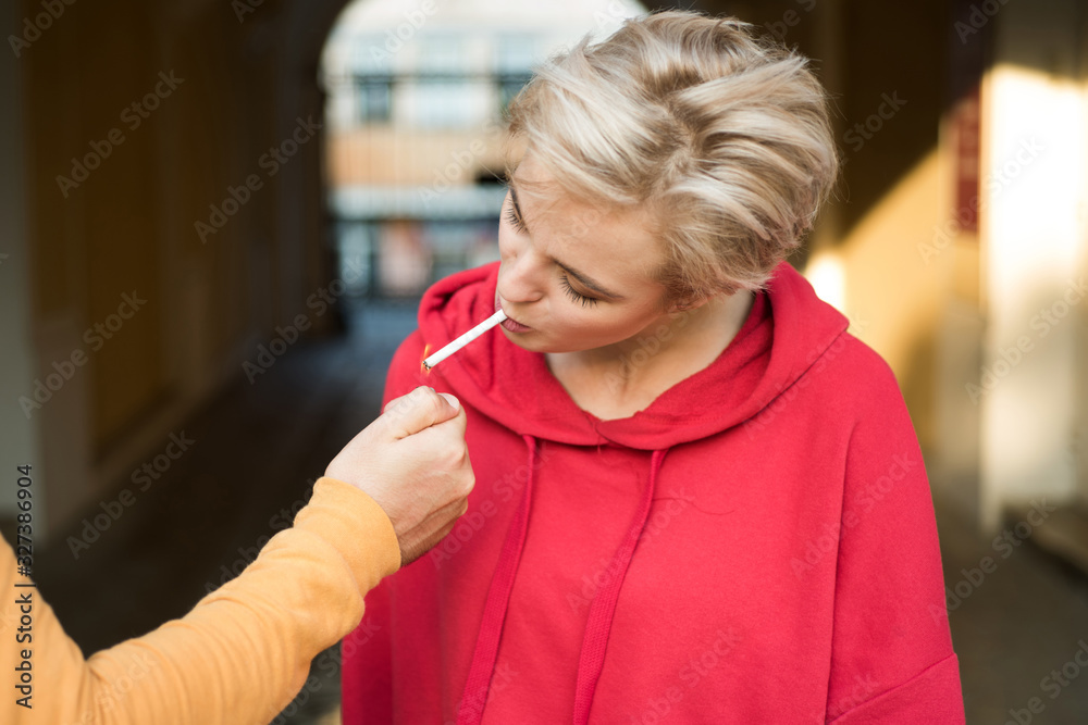 Woman smoking cigarette urban background. Pause for relaxing smoking. Couple find place for