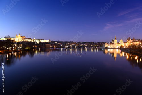 panoramic view To Hradschin Castle  St. Vitus Cathedral And Charles Bridge In Prague  Czech Republic during sunset with dramatic sky