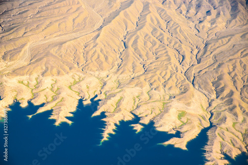 Aerial Photography of landforms over Nevada with Lake Mead in view.