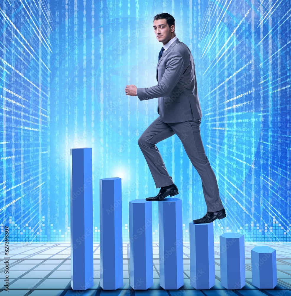 Businessman climbing bar charts in business concept Businessman climbing bar charts in business concept