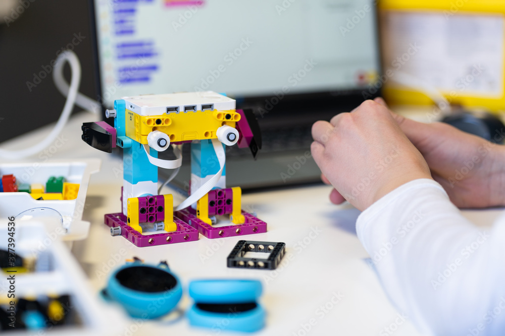 Minsk Belarus. February 2020. A teenager boy collects and programs the new Lego Spike Prime robot. STEM and STEAM education. AI. Math. Technology. Science. Mathematics. Physics. Stock Photo Adobe Stoc...