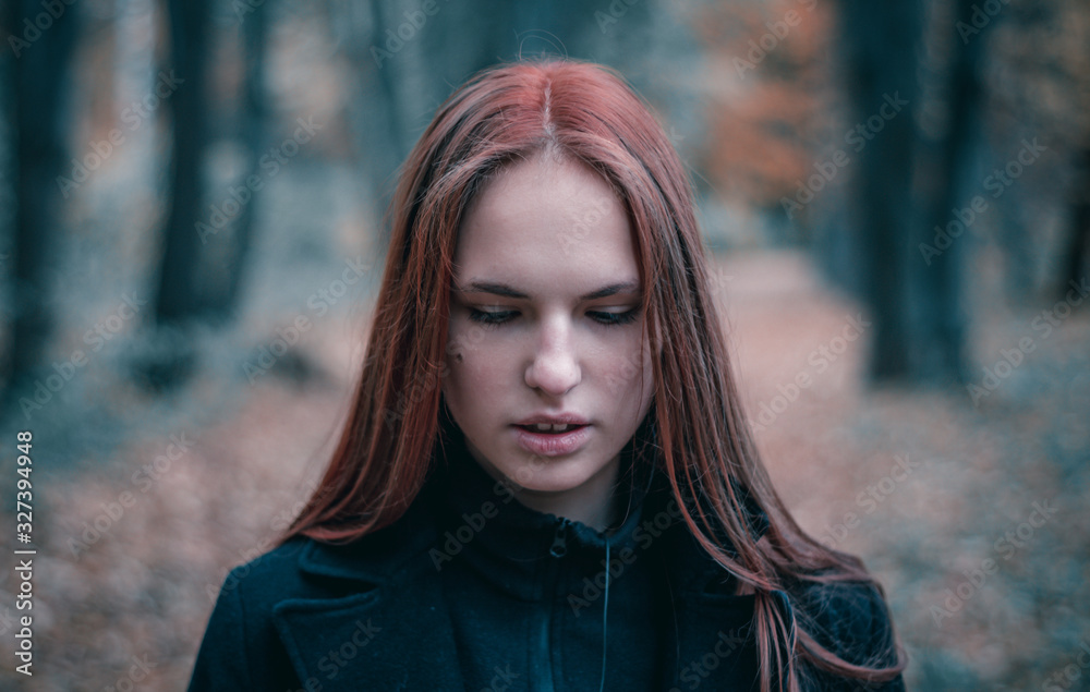 portrait of young teenager redhead girl with long hair in autumn park portrait of young teenager redhead girl with long hair in autumn park