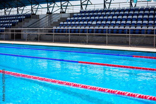 Empty swimming pool with competition lanes for background.