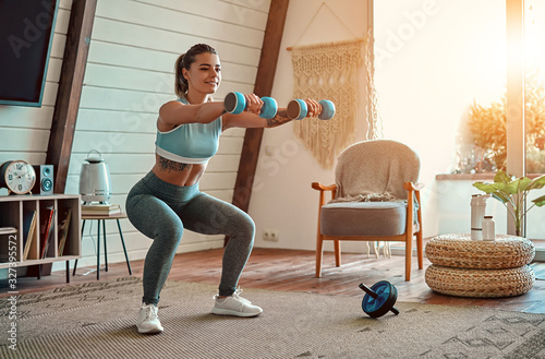 Obraz na plátně Woman doing exercises at home.