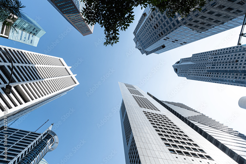 Modern business skyscrapers, high-rise buildings, architecture raising to the sky, sun. Concepts of financial, economics, future etc. Modern business skyscrapers, high-rise buildings, architecture raising to the sky, sun. Concepts of financial, economics, future etc.