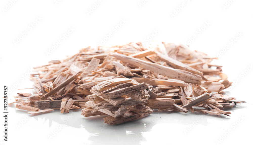 Small pile of wood chips biomass for heating industrial boilers isolated on a white background. Raw material sample close up Small pile of wood chips biomass for heating industrial boilers isolated on a white background. Raw material sample close up