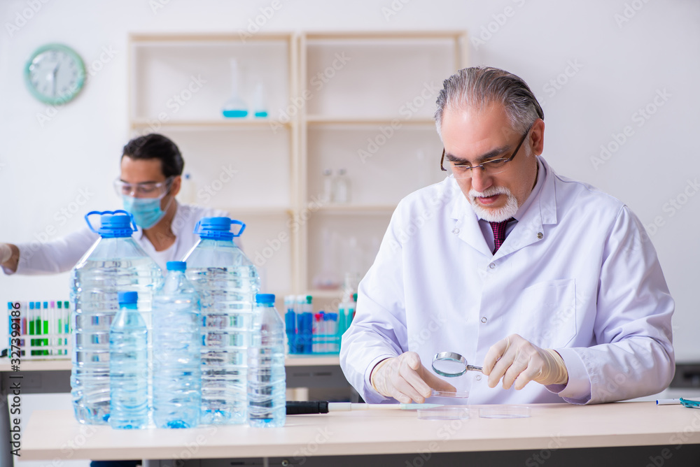 Two chemists working in the lab Two chemists working in the lab
