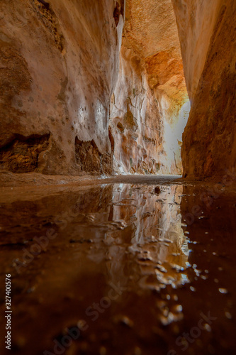 Fototapeta Naklejka Na Ścianę i Meble -  Reflection from a puddle at the bottom of an ancient water reservoir in Zippori Park, Israel