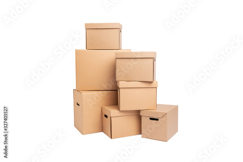Stack of empty cardboard boxes isolated on white background closeup.