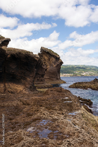 Amazing landscape in the Azores, Portugal. Large rocks against the blue sky on the uninhabited volcanic island of Vila Franca. Travel to the Azores.