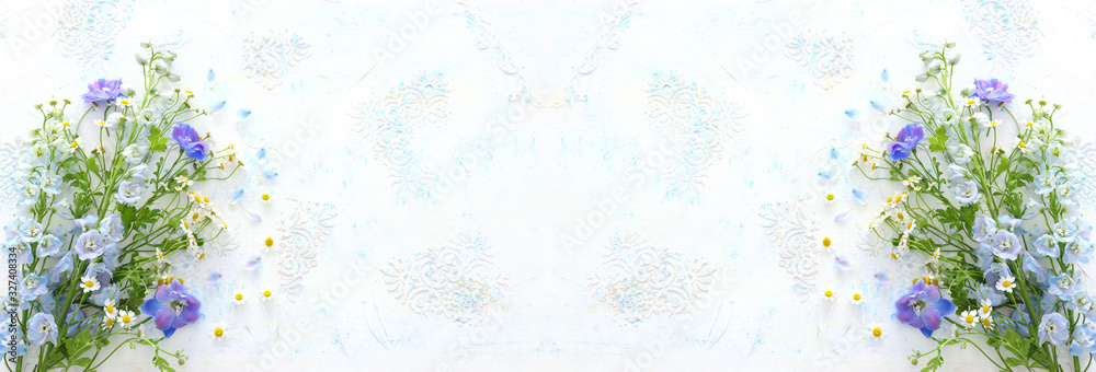 spring bouquet of white and blue flowers over white vintage wooden background. top view, flat lay spring bouquet of white and blue flowers over white vintage wooden background. top view, flat lay