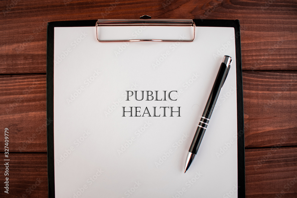 Words public health: text written on a shit of paper of notebook on the wooden background. Medical concept. Words public health: text written on a shit of paper of notebook on the wooden background. Medical concept.