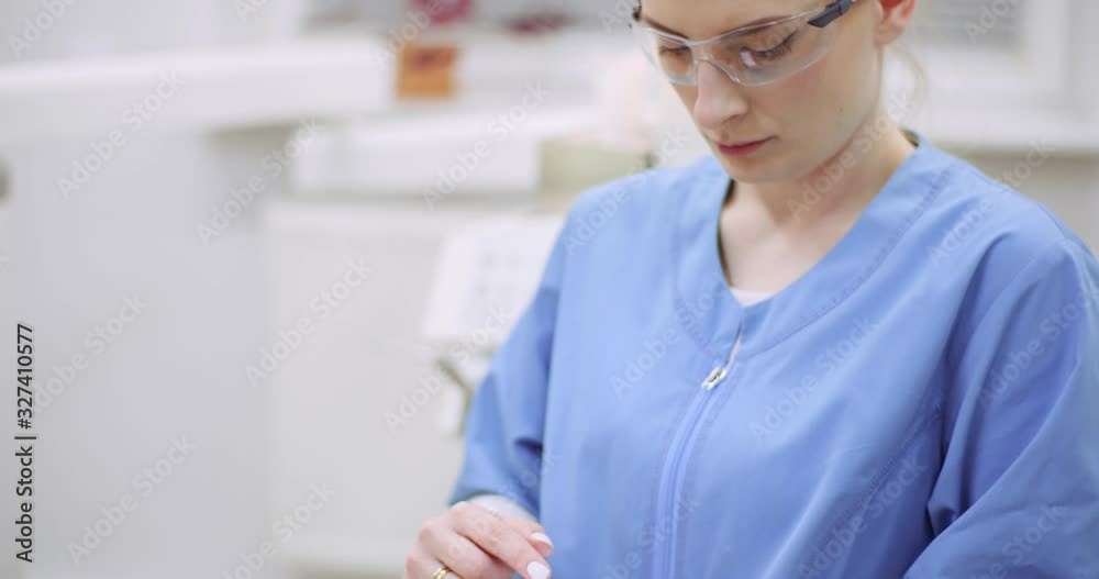 female doctor using mobile at healthcare clinic