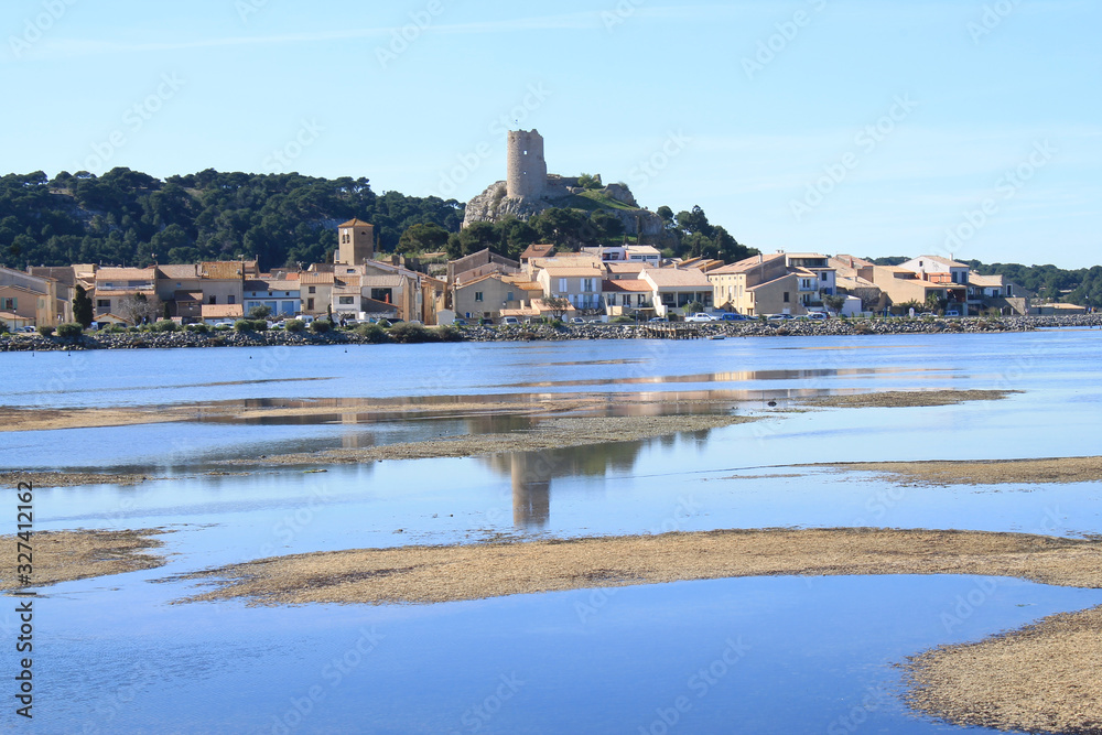 The old town of Gruissan in the heart of Regional Natural Park of Narbonne, dominated by its castle, the ruins of the Barberousse tower and its small fishermen's houses, Aude, France