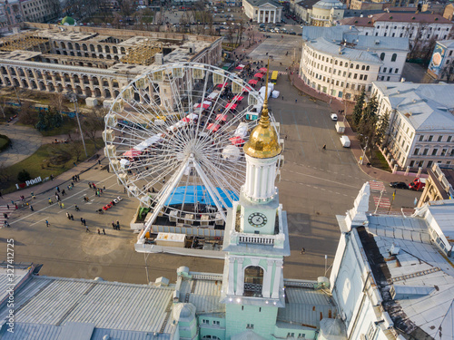 Aerial drone view. Ferris wheel and a chapel on Contact Square in Kiev. photo