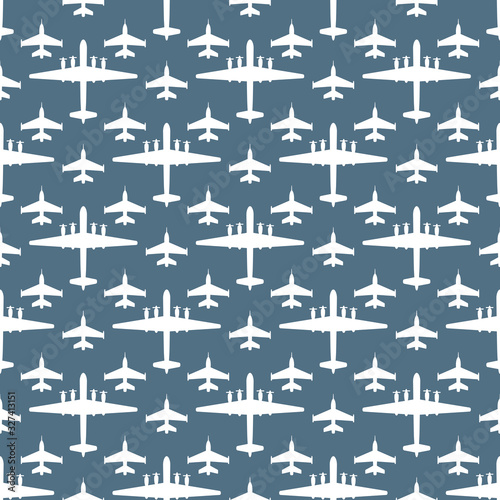 seamless pattern with silhouettes of military aircraft