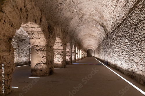 Wallpaper Mural Wide low angle view of the ruins of an ancient Roman vaulted arcade, lined with round arches Torontodigital.ca