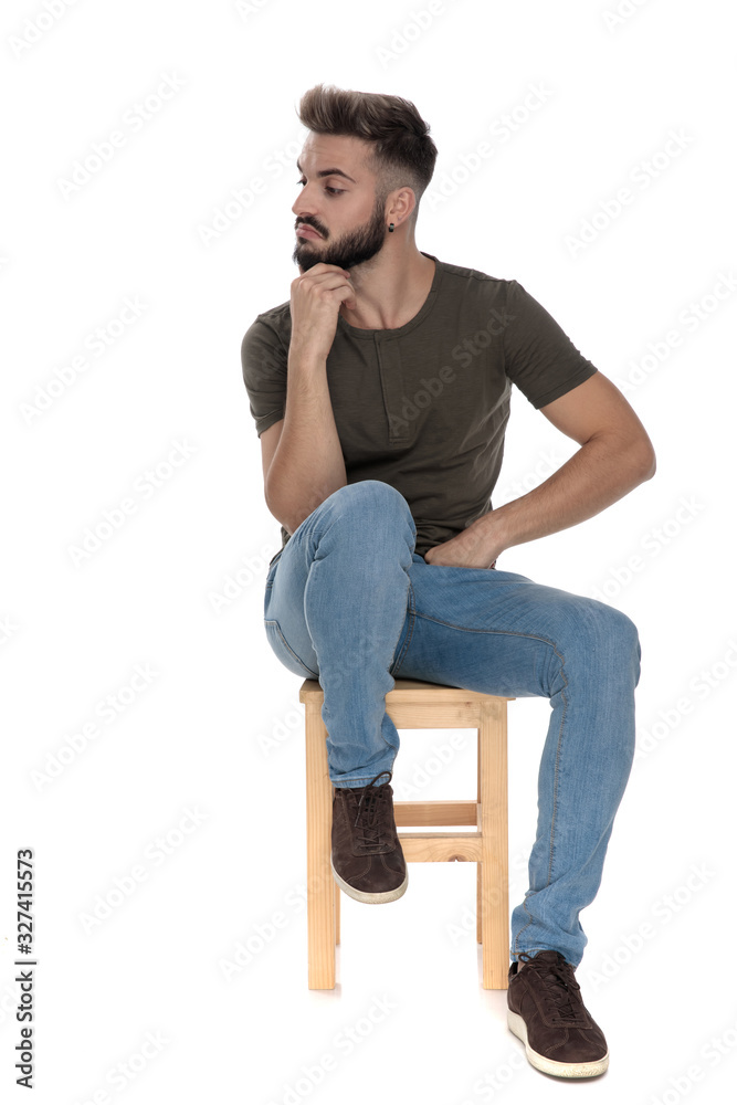 Curious casual man looking away Curious casual man looking away