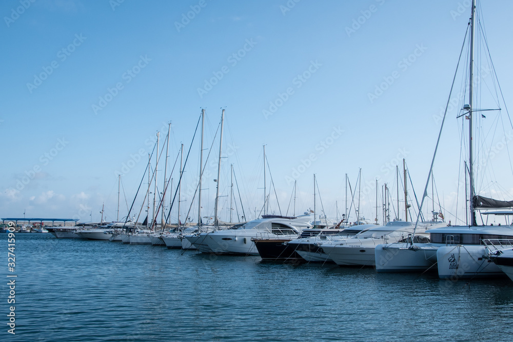 Obraz premium MARBELLA, SPAIN - February 28, 2020 - Boats and yachts moored in the sport port, Marbella, Malaga Province, Andalucia