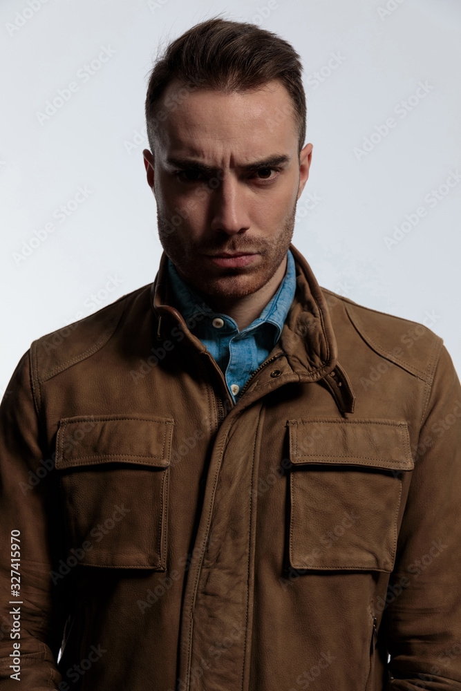 Upset fashion frowning and looking forward Upset fashion frowning and looking forward