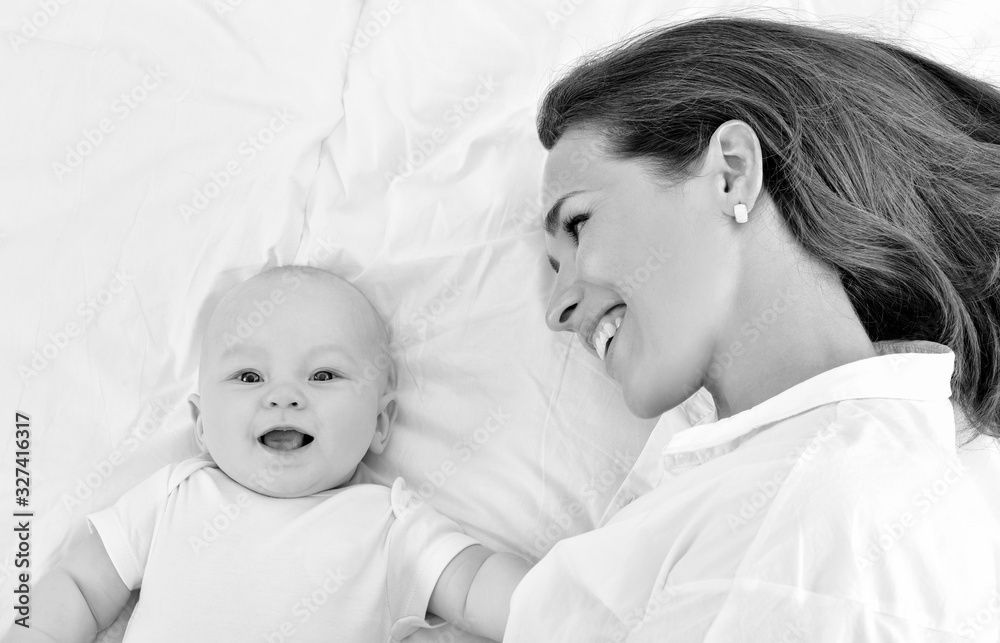 Mother and baby playing and smiling. Happy family. Mother and baby playing and smiling. Happy family.
