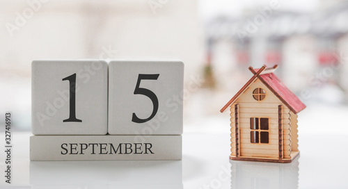 September calendar and toy home. Day 15 of month. Card message for print or remember