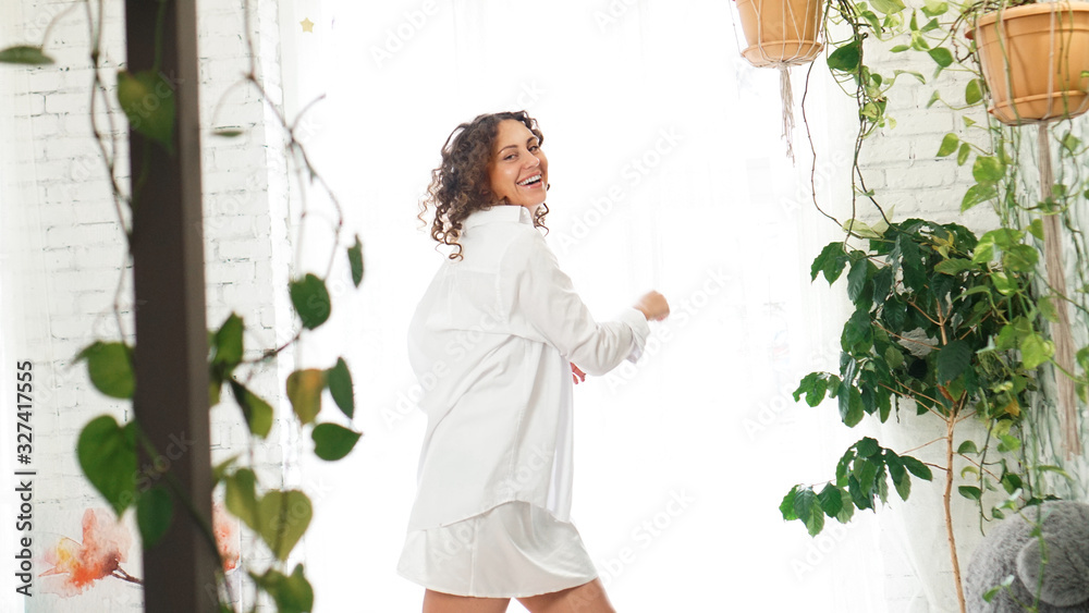 Beautiful woman after waking up in the morning. Healthy and happiness concept. Dancing happily with a smile Beautiful woman after waking up in the morning. Healthy and happiness concept. Dancing happily with a smile