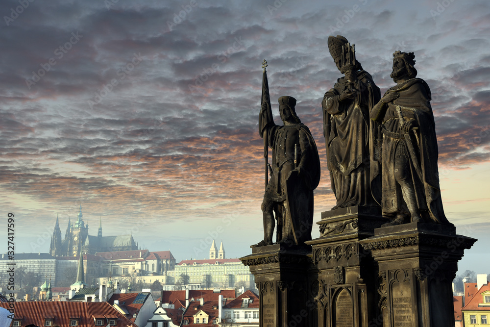 Obraz premium Statues of Saints Norbert, Wenceslaus and Sigismund on Charles Bridge in Prague, Czech Republic. Medieval Gothic bridge, finished in the 15th century, crossing the Vltava River