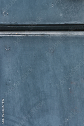 Blue stucco wall with relief. Neutral background. Grunge plaster texture. Classic blue background with stripe.