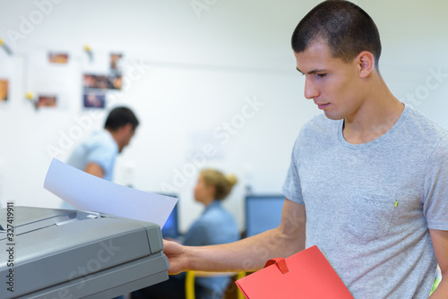 a male student printing document