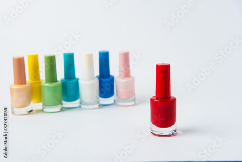 colored nail polishes on a white background