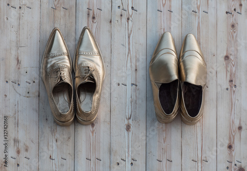 golden shoes on a wooden floor