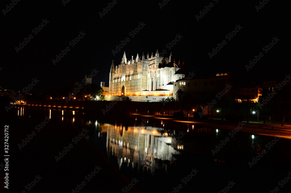 Mallorca, Spain, July 16th 2016: Cathedral of Palma de Mallorca with the reflection on the water at night