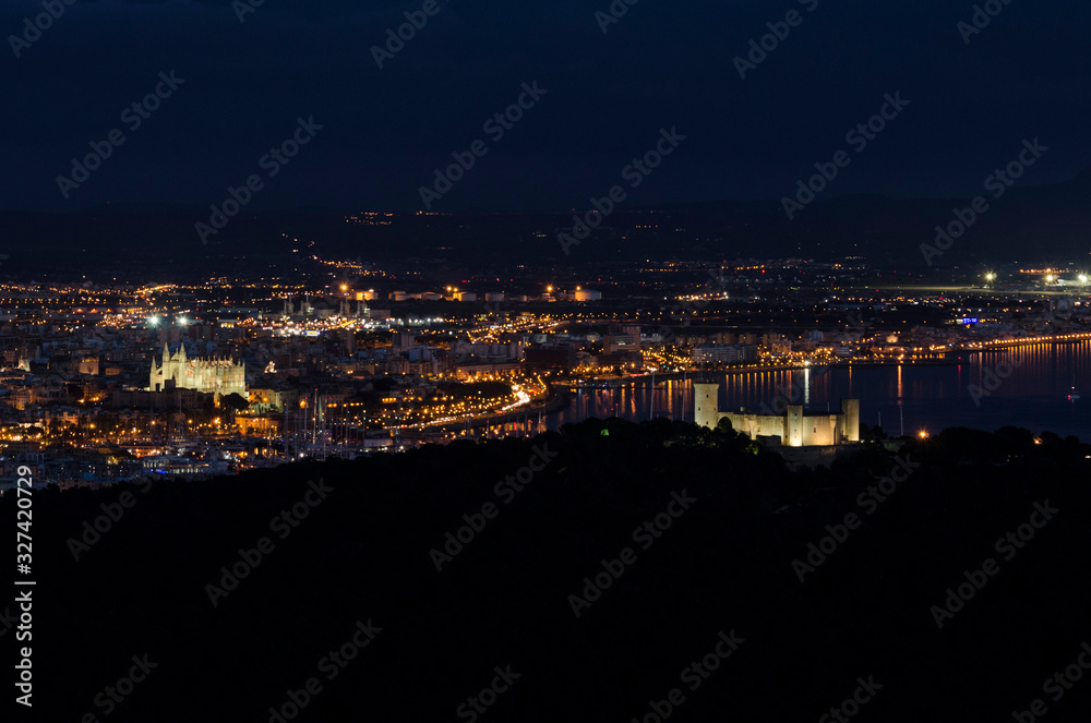 Mallorca, Spain, December 12 2016: Cathedral and Bellver Castle at Night .Aeral view of Palma de Mallorca Harbour.