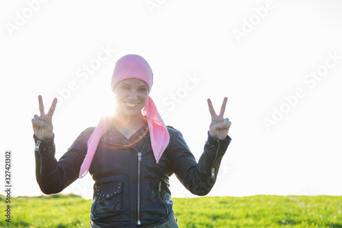 Woman with pink headscarf.