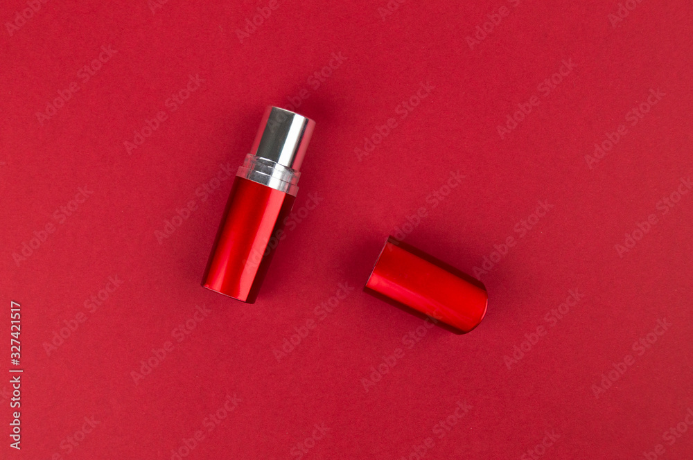 Red lipstick lies on the surface Red lipstick lies on the surface