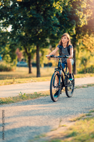 Girl Riding Her Bike To School