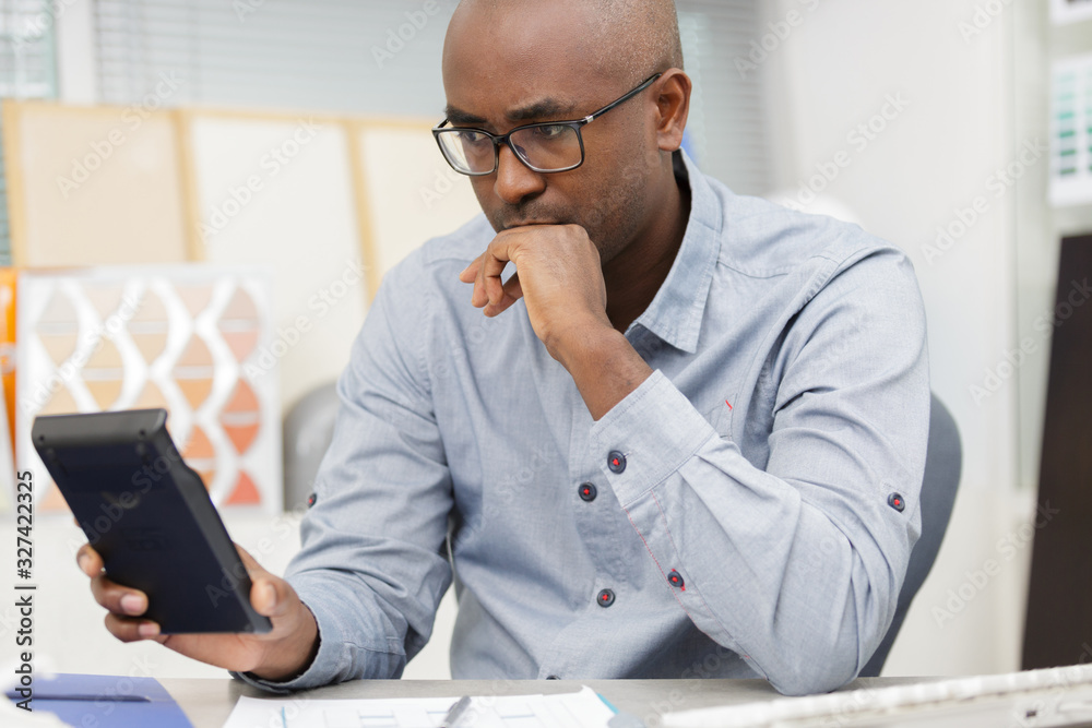 man paying bills on computer