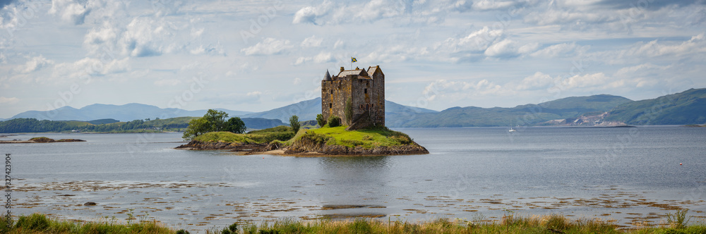 Castle Stalker in Scotland, UK during sunny day
