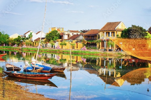 Boats in Embankment of Thu Bon River Hoi An Vietnam photo