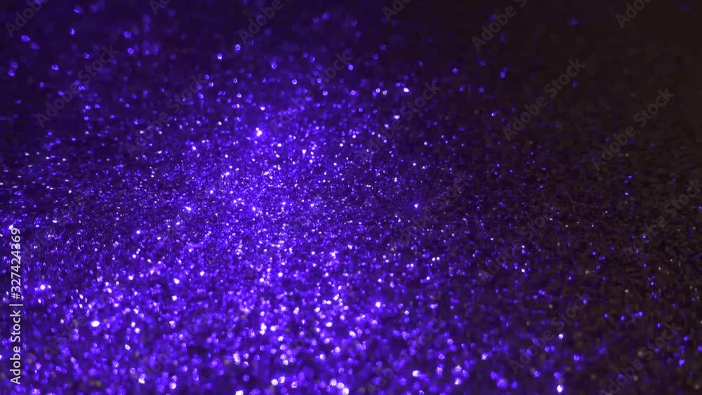 Magical purple blue dust illuminated by magical glowing moving light source. Shallow depth of field. Magical purple blue dust illuminated by magical glowing moving light source. Shallow depth of field.