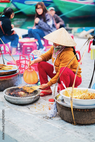 Woman selling fried meat street market Hoi An