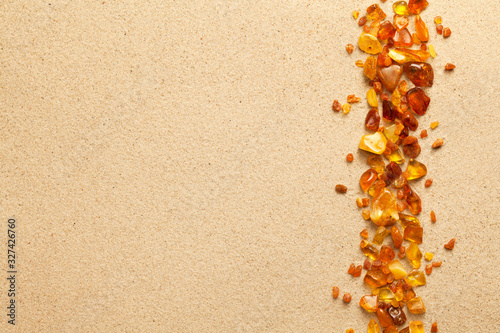Fototapeta Naklejka Na Ścianę i Meble -  Ambers On Sand Background