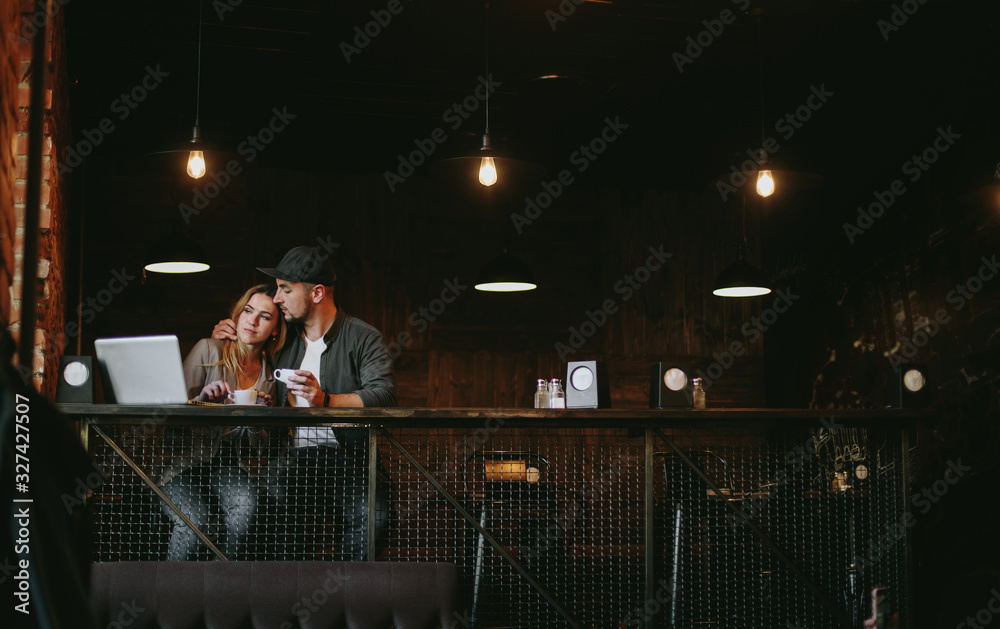 Young couple in loft cafe