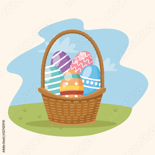 happy easter card with eggs painted in basket