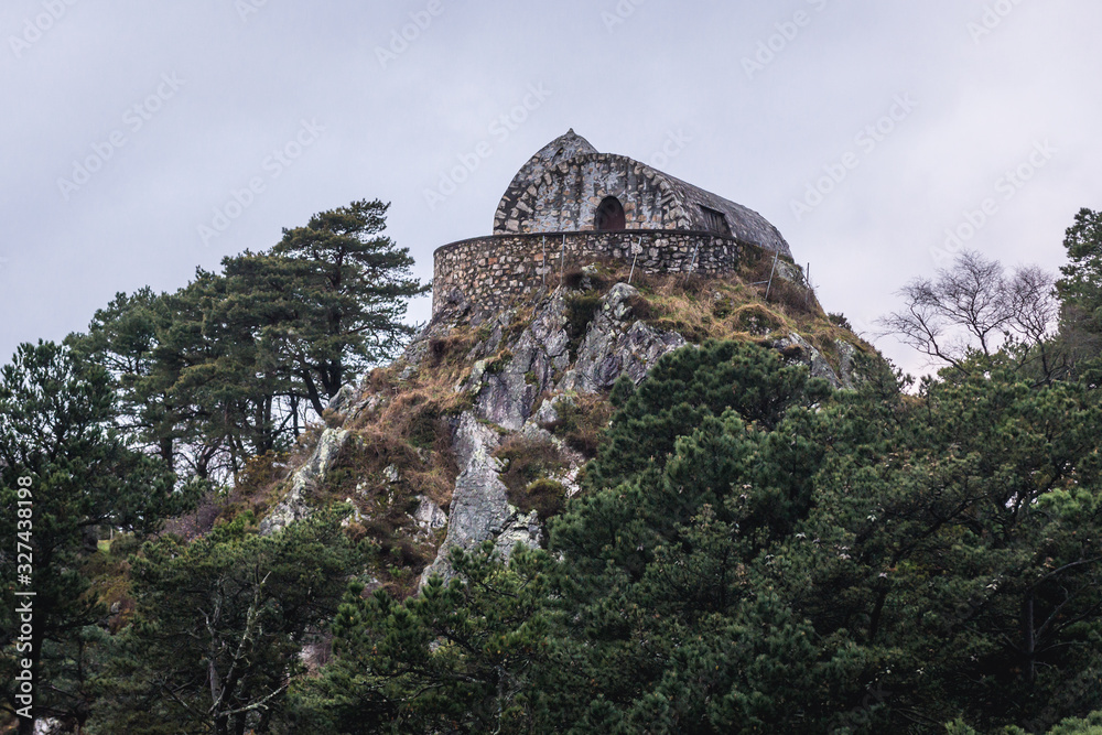 Stone building on a mountain top next to Mirador del Fito viewpoint in Sierra del Sueve mountains in Spain