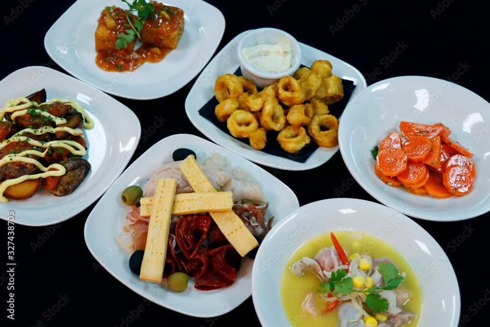 spanish tapas. tapa is an appetizer or snack in Spanish cuisine and translates to small portion of any kind of Spanish cuisine, marinated carrot,seafood,calamari etc spanish tapas. tapa is an appetizer or snack in Spanish cuisine and translates to small portion of any kind of Spanish cuisine, marinated carrot,seafood,calamari etc
