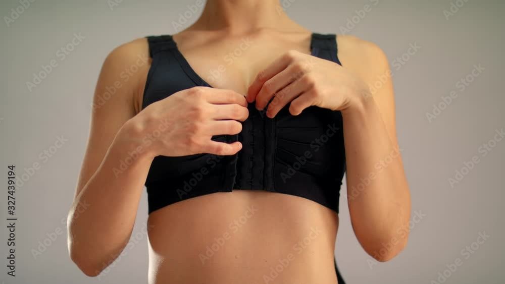 Breast  implantation  Pleased woman in elasto-fit compression enjoying result of mammoplasty Compression linen is used after Plastic Surgery  Shot URSA 4.6K