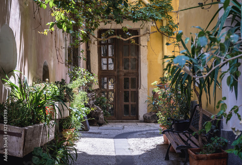 Narrow street in old town of Catania city on Sicily Island and autonomous region of Italy